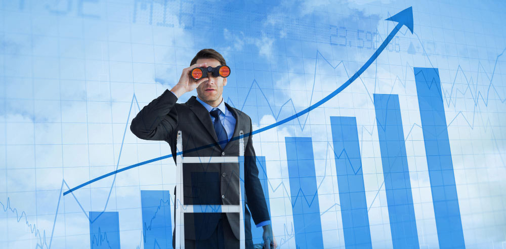 Businessman on a ladder looking through binoculars in front of rising blue bar and line charts symbolizing growth and future outlook.